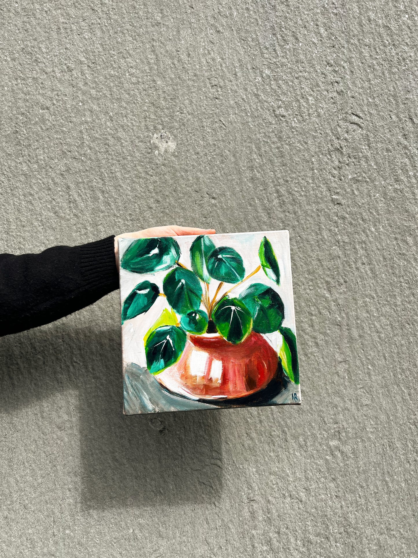 Painting of a green leafy plant in a red ceramic pot, set against a light background, capturing a serene and natural aesthetic